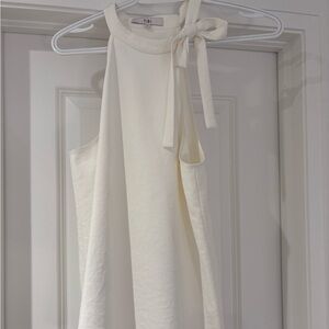 Like new - Elegant Tibi blouse size US0 in a soft warm white colour.